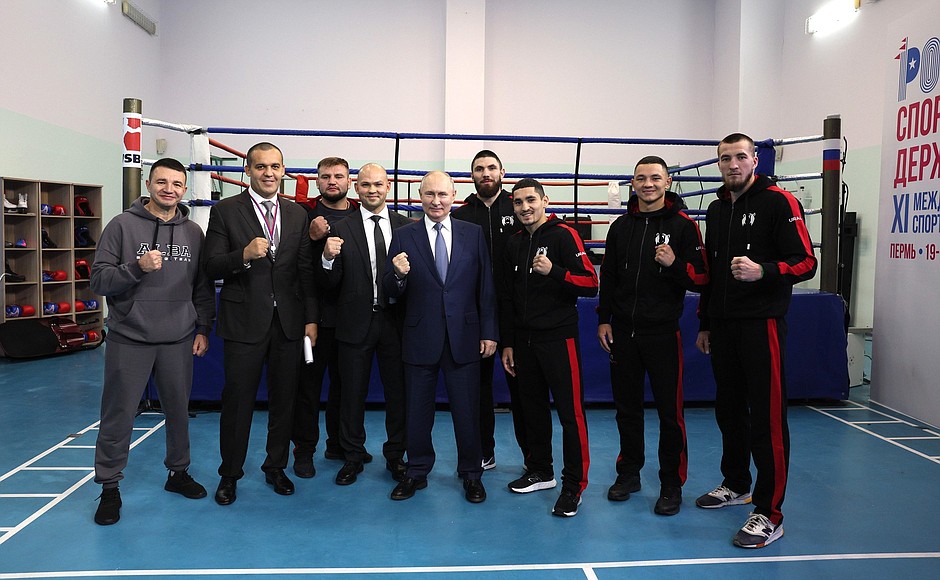 With participants in a professional boxing tournament.