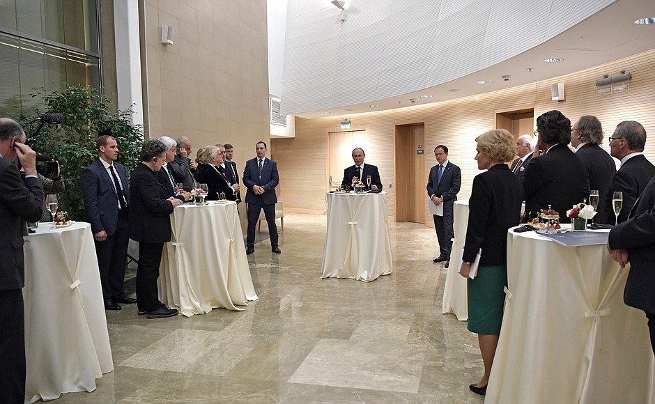 At an informal meeting with Russian and foreign cultural figures.