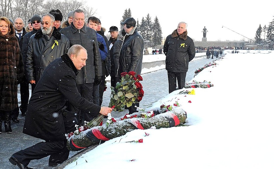 Beside one of the common graves at the Piskarevskoye Memorial Cemetery, Mr Putin honoured the memory of his brother, who died in the blockade.