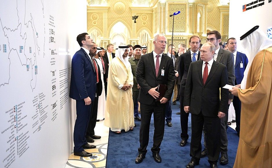 President of Russia Vladimir Putin and Crown Prince of Abu Dhabi and Deputy Supreme Commander of the UAE Armed Forces Mohammed bin Zayed Al Nahyan visit an exhibition of investment projects. Russian Direct Investment Fund CEO Kirill Dmitriev gives explanations.