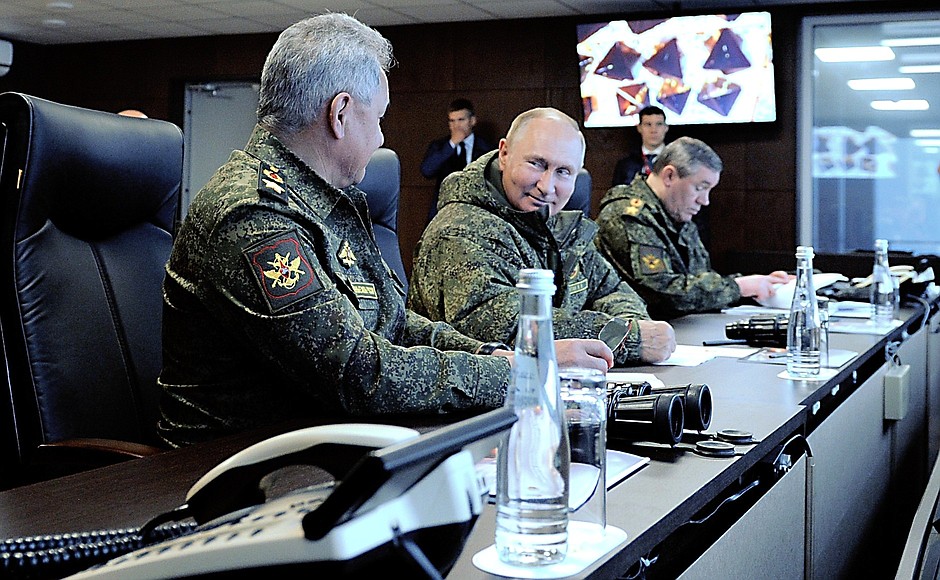 Vladimir Putin, together with Defence Minister Sergei Shoigu, left, and Chief of the General Staff of the Russian Armed Forces and First Deputy Defence Minister Valery Gerasimov, observed the main stage of the Vostok-2022 strategic command post exercise at the Sergeyevsky range in the Primorye Territory.