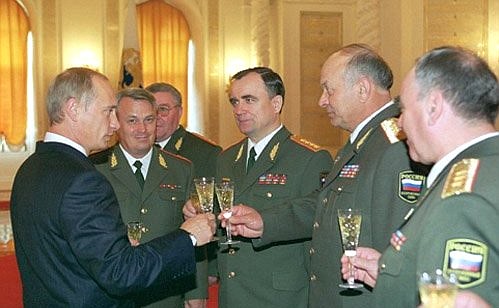President Putin meeting with newly promoted military officers in rank and office.