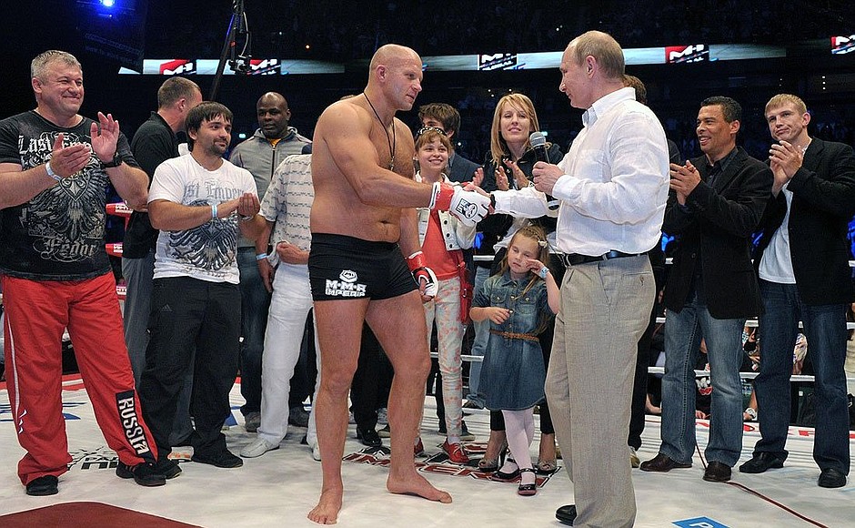 At the White Nights mixed martial arts tournament. Vladimir Putin personally congratulates many-time world MMA champion Fedor Yemelyanenko.