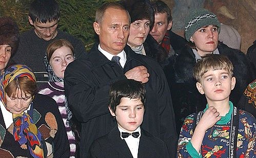 President Putin attending a service at the Church of the Sign of the Holy Mother of God.