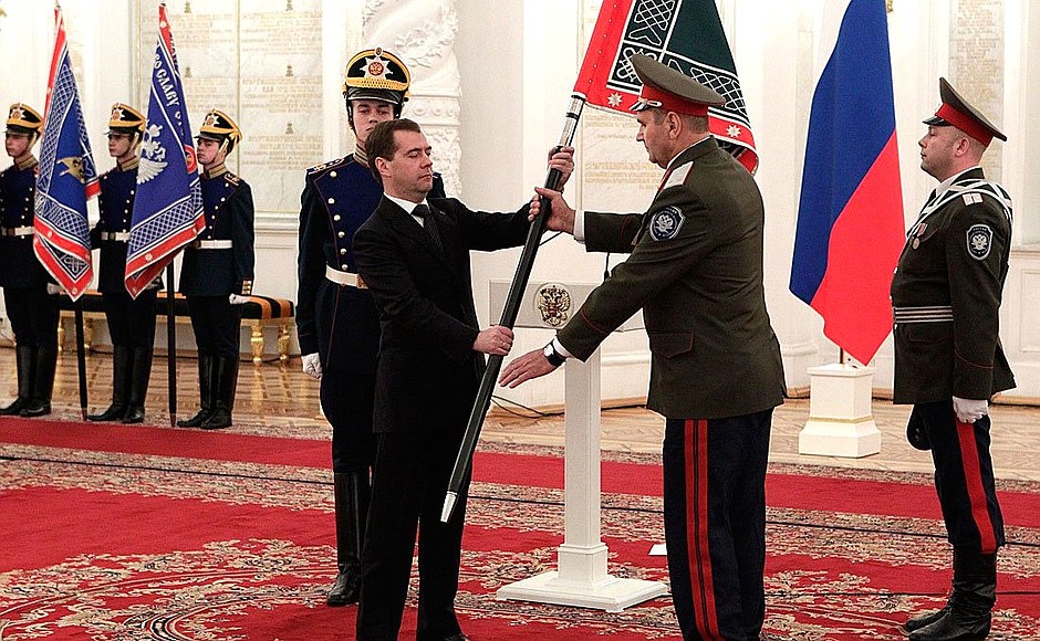 Presenting banners to Cossack military societies. Dmitry Medvedev presents the banner of Yeniseysk Cossack military society to ataman Pavel Platov.