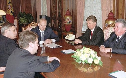 Vladimir Putin with newly-appointed Gazprom CEO Alexei Miller (second from right), former Gazprom CEO Rem Vyakhirev (right), Prime Minister Mikhail Kasyanov and deputy chief of the Presidential Executive Office Dmitry Medvedev (left).