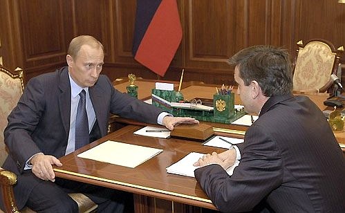 President Vladimir Putin meeting with Mikhail Zurabov, chairman of the board of the Pension Fund.