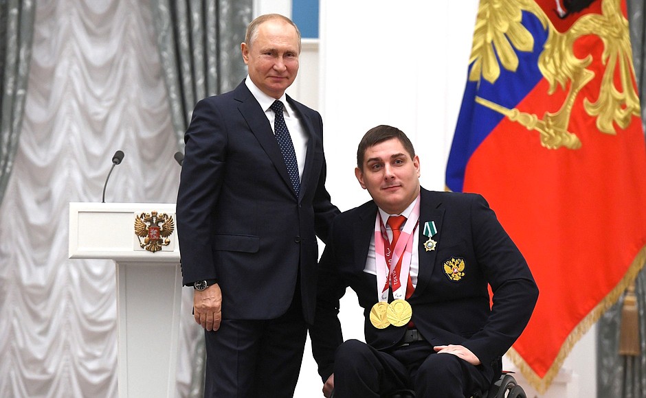 Presenting state decorations to winners of the 2020 Summer Paralympic Games in Tokyo. Two-time Paralympic champion in wheelchair fencing Alexander Kuzyukov receives the Order of Friendship.