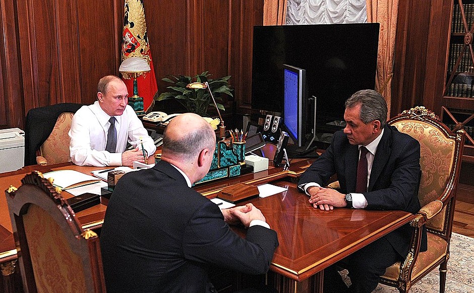 With Defence Minister Sergei Shoigu and Finance Minister Anton Siluanov.