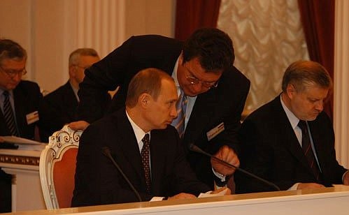 President Putin with his aide Sergei Prikhodko at a meeting of the Supreme State Council of Russia and Belarus. On his right is Federation Council Speaker Sergei Mironov.