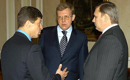 President Putin before meeting with Government members. Left to right, Dmitry Kozak, the deputy head of the Presidential Executive Office, Deputy Prime Minister Alexei Kudrin and Prime Minister Mikhail Kasyanov.
