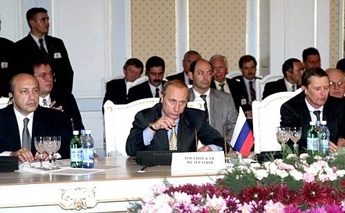 An extended meeting of the Shanghai Five heads of state. President Putin with Foreign Minister Igor Ivanov, to the left, and Security Council Secretary Sergei Ivanov.