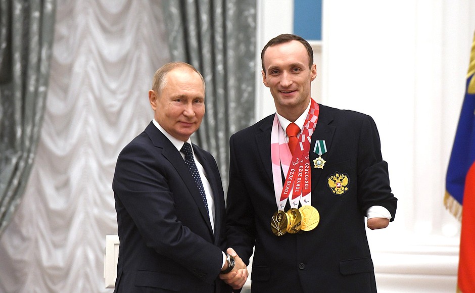 Presenting state decorations to winners of the 2020 Summer Paralympic Games in Tokyo. Andrei Kalina, three-time swimming champion of the Paralympics, receives the Order of Friendship.