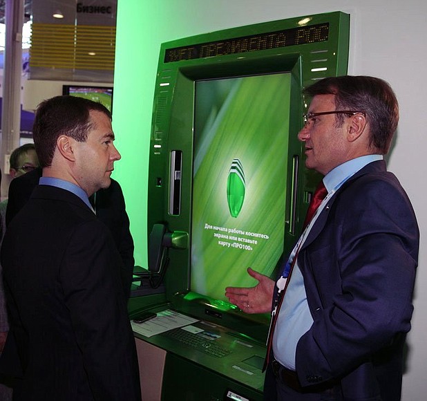 Visiting the display stand of Sberbank, partner companie of the St Petersburg International Economic Forum. With Sberbank CEO German Gref.