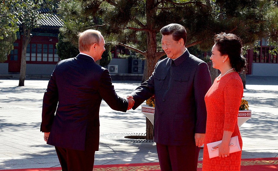 Before military parade to mark the 70th anniversary of the Chinese people’s victory in the War of Resistance against Japan and the end of World War II. With President of China Xi Jinping and his wife Peng Liyuan.