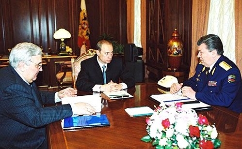 A meeting with Yury Koptev (left), head of the Russian Aerospace Agency, and Marshal Yevgeny Shaposhnikov, an aide to the Russian president.