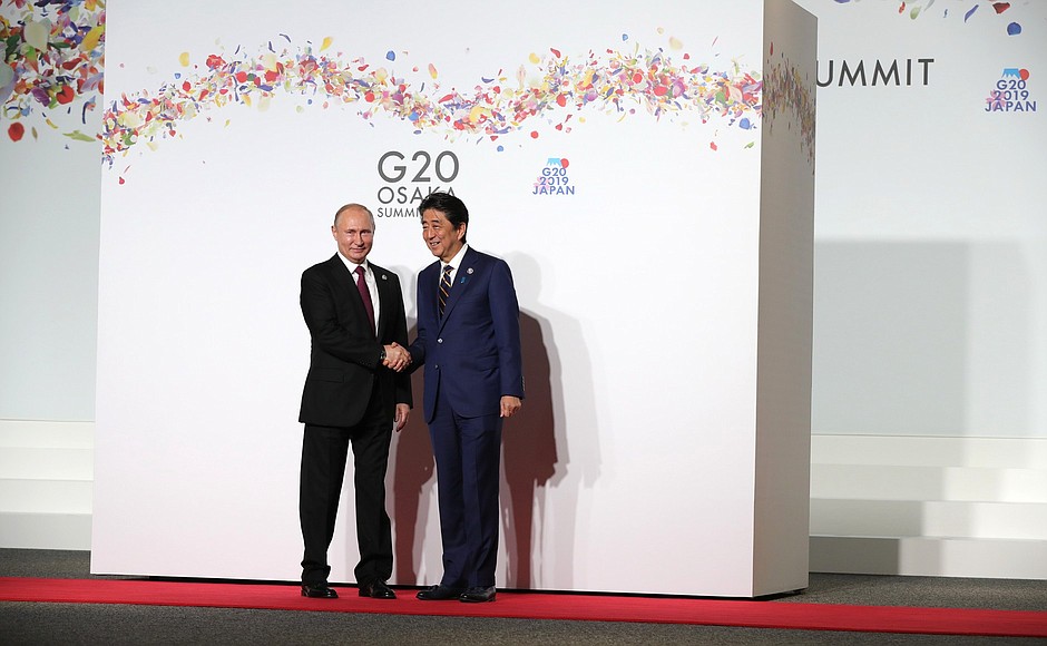 With Japanese Prime Minister Shinzo Abe before the first working meeting at the G20 summit.