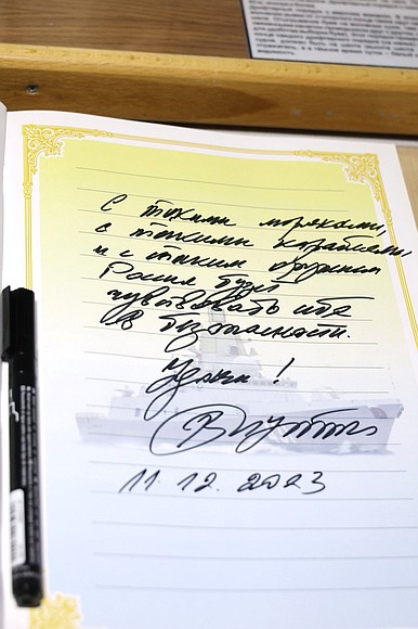 As a memento of his visit to frigate Admiral Kasatonov, the President signs the distinguished visitors’ book.