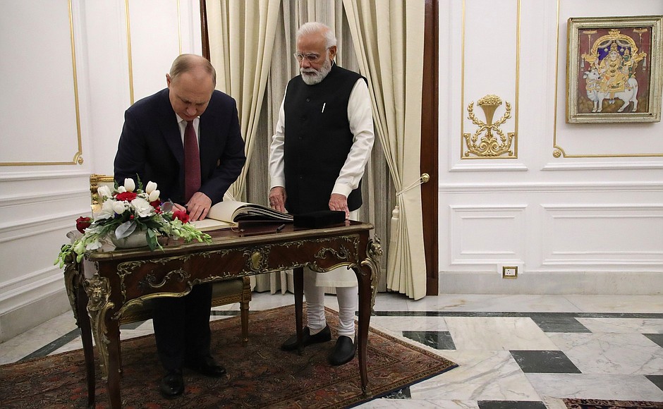 Vladimir Putin made an entry in the book of guests of honour at Hyderabad House.