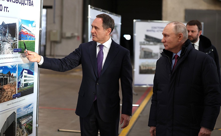 Touring the production plant of the Konar Industrial Group. Company Director General Valery Bondarenko explains the manufacturing processes (left).