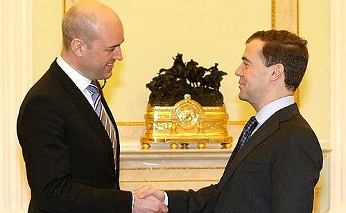 With Prime Minister of Sweden Fredrik Reinfeldt.