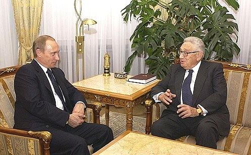 President Putin meeting with former Secretary of State Henry Kissinger.