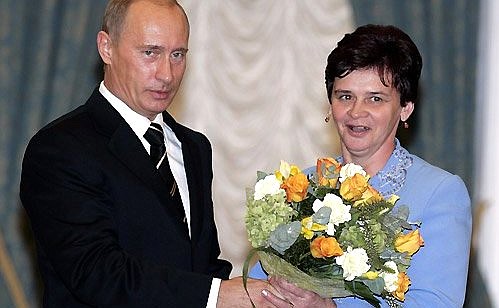 At a ceremony awarding state decorations. Nina Brusnikova is decorated with the Hero of Russia medal for heroism and self-sacrifice shown while saving a livestock complex from fire, and for outstanding achievements in her work.