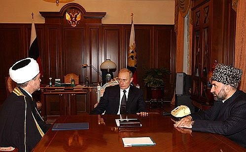 President Vladimir Putin with Ravil Gainutdin, chairman of the Council of Muftis of the Muslim Board for European Russia, and Mufti Magomed Albogachiev, chairman of the Coordination Centre of North Caucasian Muslims and of the Muslim Board for Ingushetia.