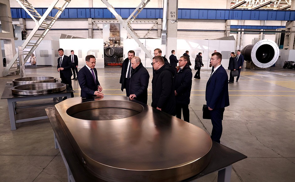 Touring the production plant of the Konar Industrial Group. Company Director General Valery Bondarenko explains the manufacturing processes (left).