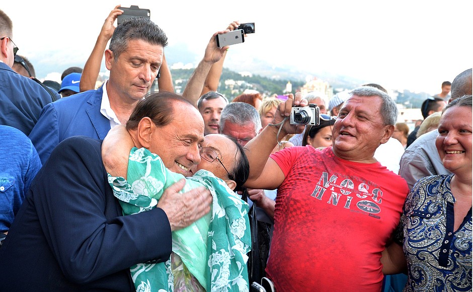 Silvio Berlusconi during a walk along the esplanade in Yalta.