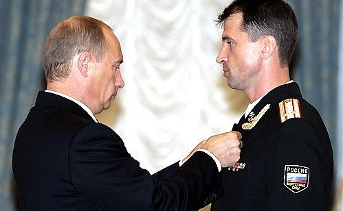 At a ceremony awarding state decorations. Lieutenant-Colonel Vladimir Belyavsky is decorated with the Hero of Russia medal for courage and heroism while performing his military duties.