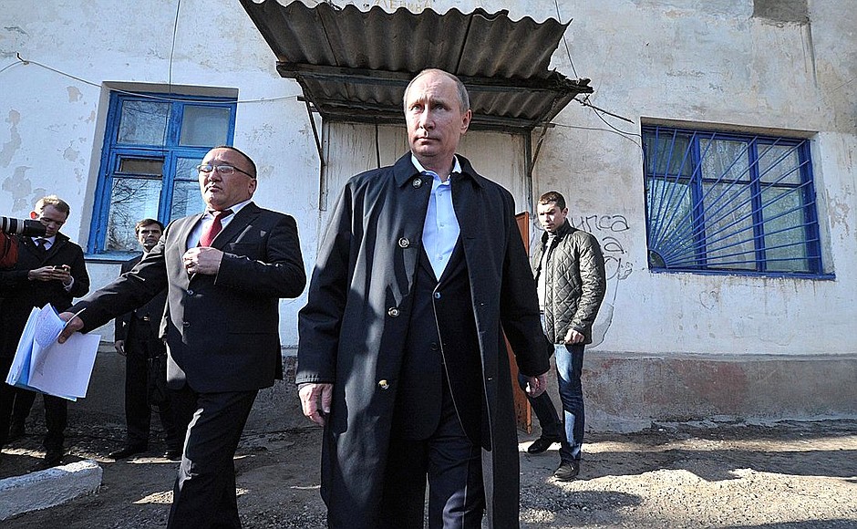 During his visit to Kalmykia, Vladimir Putin viewed an old building whose residents are due for resettlement.