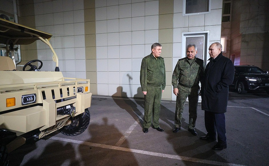 At the headquarters of the Southern Military District. With Defence Minister Sergei Shoigu and Chief of the General Staff of Russia's Armed Forces Valery Gerasimov (left).