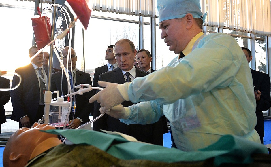 Vladimir Putin visits the Made in Russia exhibition that showcases the latest developments in medicine, laboratory diagnostics, sports and car manufacturing.