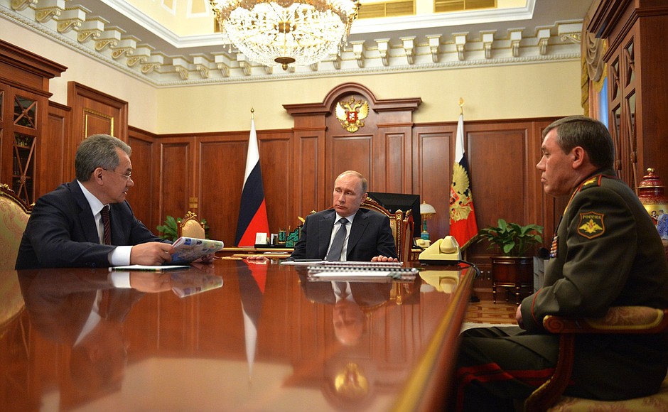 With Defence Minister Sergei Shoigu and Chief of the General Staff Valery Gerasimov.