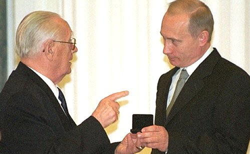 President Putin meeting with WWII veterans. The ceremony of presenting state awards. Henryk Adamowicz (Poland) presented President Putin with a memorable medal of the Polish Armed Forces.