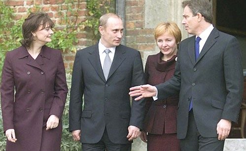 Vladimir and Lyudmila Putin with British Prime Minister Tony Blair and his wife, Cherie, at the Prime Minister\'s country residence.