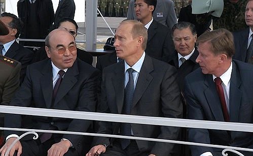 President Putin watching demonstration flights of Russian warplanes with Kyrgyz President Askar Akayev and Russian Defence Minister Sergei Ivanov (right).