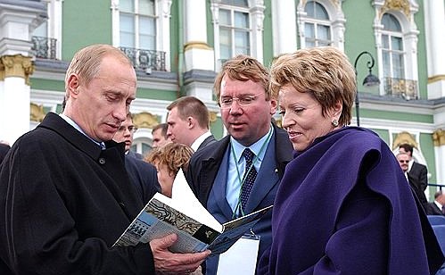 President Putin with Director of the Administrative Board of the Russian President Vladimir Kozhin and Presidential Envoy to the Northwestern Federal District Valentina Matviyenko outside the State Hermitage Museum.
