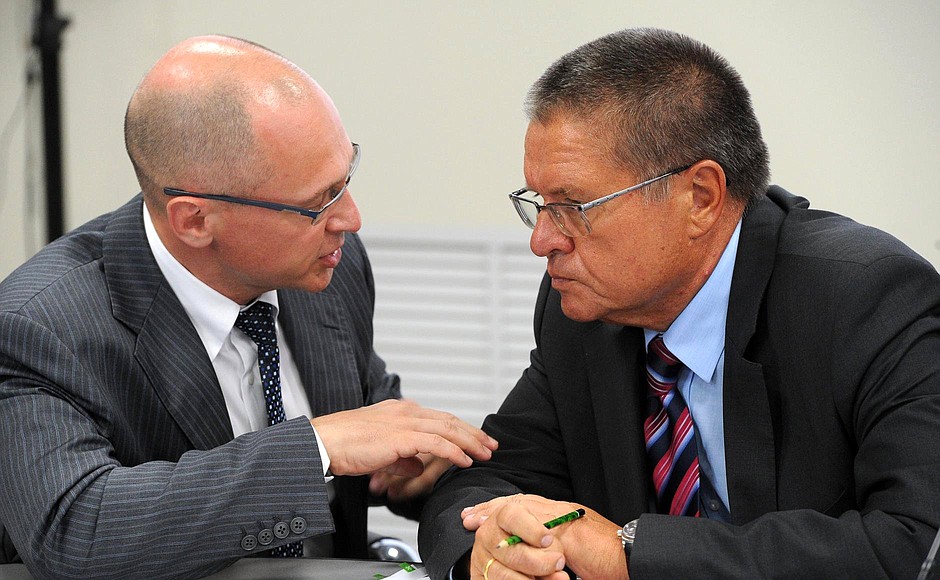 CEO of Rosatom State Atomic Energy Corporation Sergei Kiriyenko and Minister of Economic Development Alexei Ulyukayev (right) before the meeting on developing the production and use of rare earth metals.