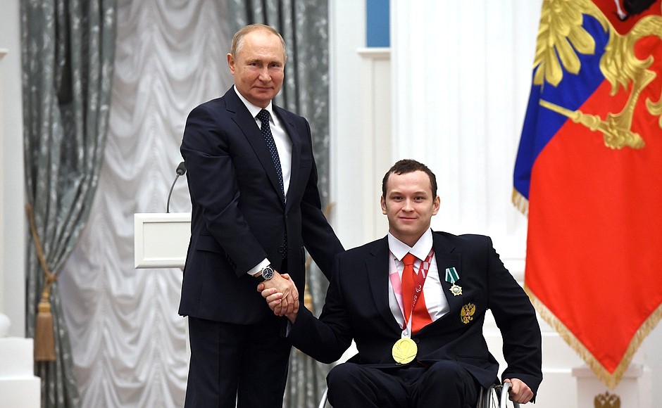 Presenting state decorations to winners of the 2020 Summer Paralympic Games in Tokyo. Dmitry Chernyaev, swimming champion of the Paralympics, receives the Order of Friendship.