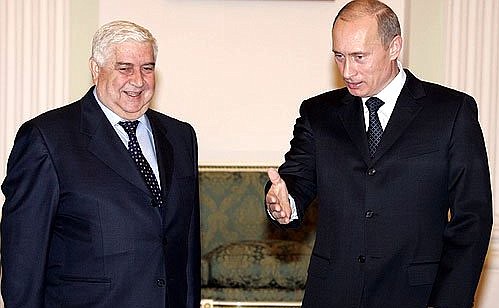 At the meeting with Syrian Foreign Minister Walid Moallem.