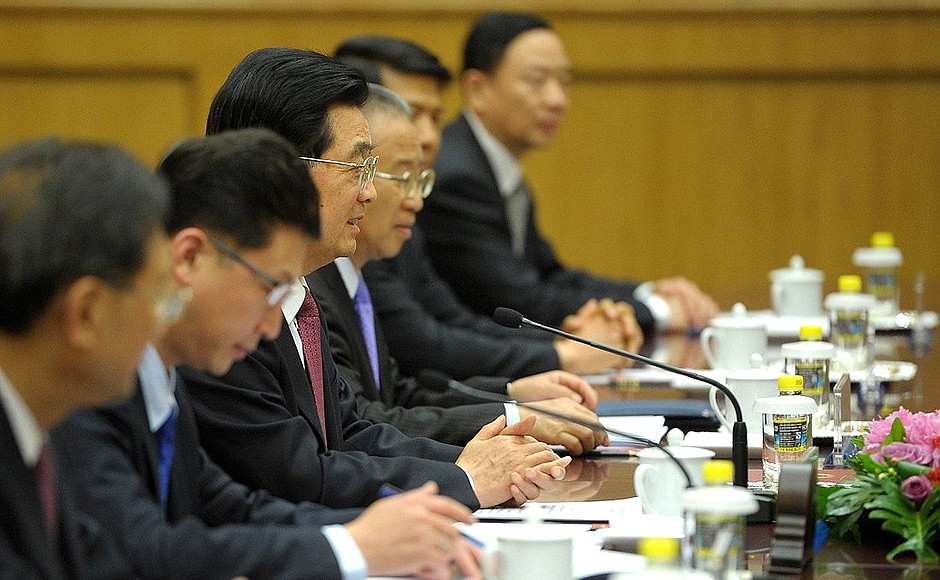 At a meeting with Vladimir Putin and President of China Hu Jintao.