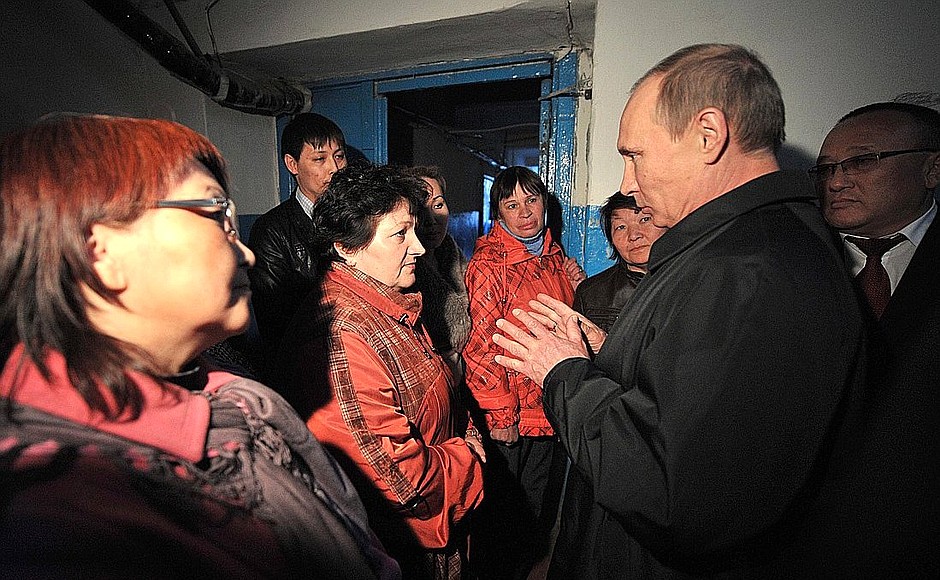 During his visit to Kalmykia, Vladimir Putin viewed an old building whose residents are due for resettlement and spoke with local inhabitants.