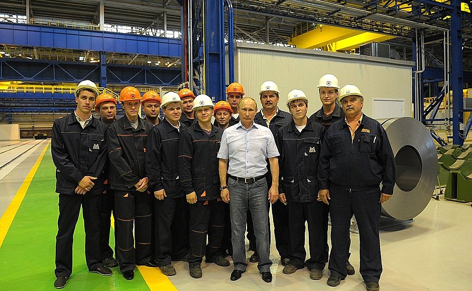 With employees of Magnitogorsk Iron and Steel Works .
