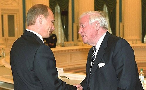 President Putin with Helmut Schmidt, a former German chancellor and chairman of the non-governmental international organisation InterAction Council.