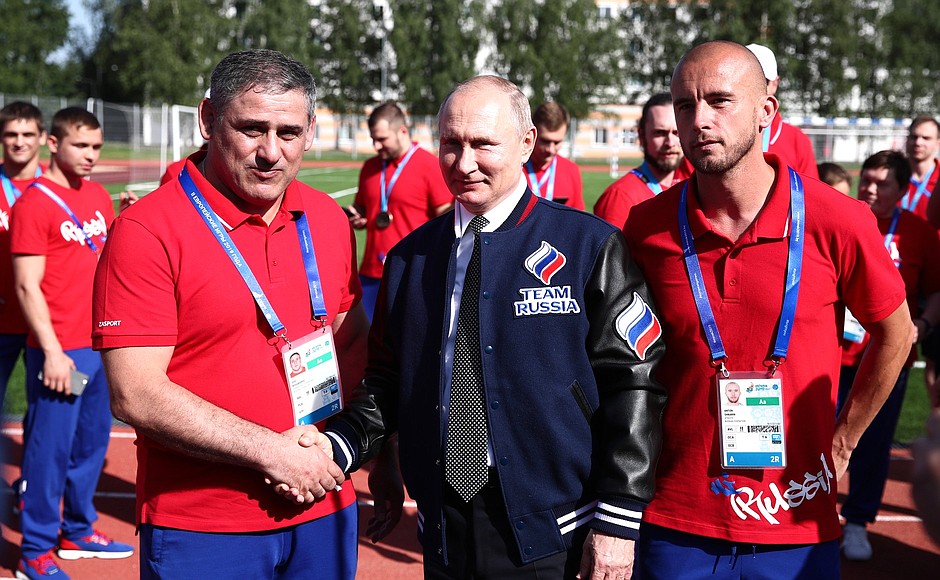 With head coach of Russian national Greco-Roman wrestling team, Gogi Koguashvili (left), and member of the Russian national beach football team Anton Shkarin at the Athletes Village of the 2nd European Games.
