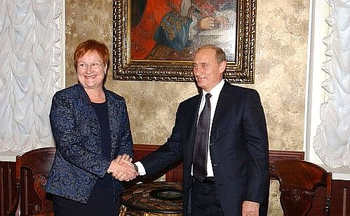 President Putin with Finnish President Tarja Halonen.