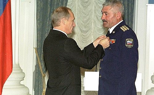 State awards presenting ceremony. President Putin presenting Lieutenant Colonel Alexander Dzyuba with the Hero Star of Russia.