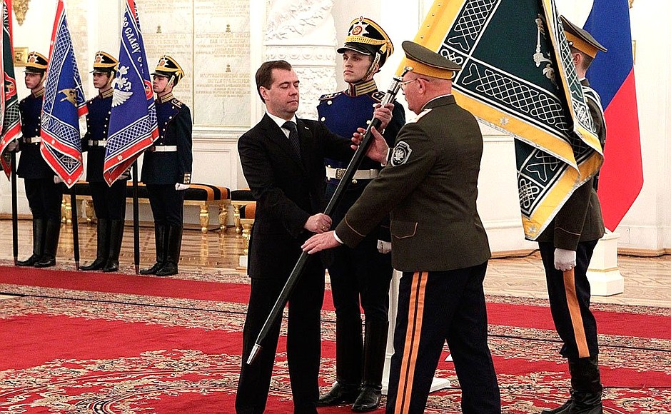 Presenting banners to Cossack military societies. Dmitry Medvedev presents the banner of Irkutsk Cossack military society to ataman Nikolai Shakhov.